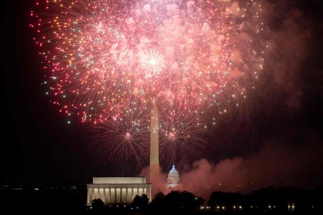 (FILES) The US Capitol and Washington Monument are seen during the Independence Day fireworks display along the National Mall in Washington, DC, on July 4, 2023. An "unforgettable" tribute to America, or a health hazard that will terrorize animals and pollute the environment? That's the question as Washington prepares to break the record for the world's largest fireworks display on the United States' 250th birthday on July 4, 2026. The Trump administration's "Freedom250" project has hired Pennsylvania-based Pyrotecnico to launch more than 850,000 fireworks shells across 10 sites around the Lincoln Memorial and Potomac River, starting at 10:30 pm and lasting 40 minutes. (Photo by Stefani Reynolds / AFP)