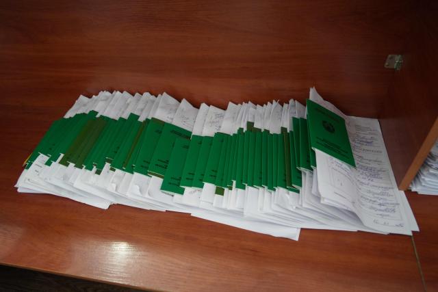 Babies' birth certificates sit on a shelf in a civil registry office in the Tajik capital of Dushanbe on June 30, 2026. (Photo by AFP)