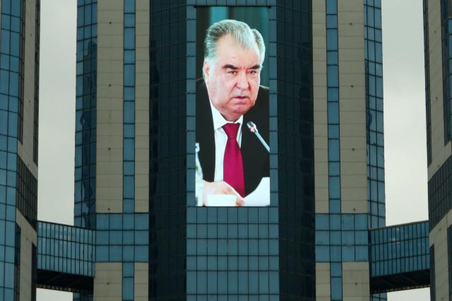 (FILES) A huge screen displays a portrait of Tajikistan's President Emomali Rakhmon in the capital Dushanbe on March 9, 2026. (Photo by AFP)