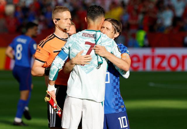 Portugal's forward #07 Cristiano Ronaldo and Croatia's midfielder #10 Luka Modric embrace each other ahead of the 2026 World Cup round of 32 football match between Portugal and Croatia at the Toronto Stadium in Toronto on July 2, 2026.  (Photo by Kamil Krzaczynski / AFP)