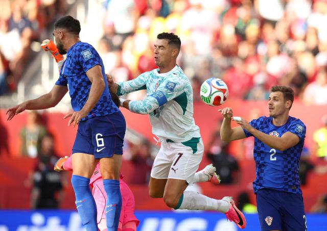 Portugal's forward #07 Cristiano Ronaldo, Croatia's defenders #06 Josip Sutalo and #02 Josip Stanisic fight for the ball during the 2026 World Cup round of 32 football match between Portugal and Croatia at the Toronto Stadium in Toronto on July 2, 2026.  (Photo by Cole Burston / AFP)