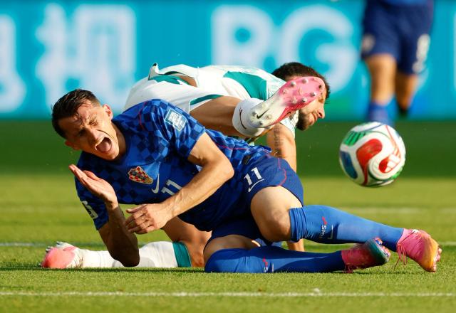 Croatia's forward #11 Ante Budimir is fouled by Portugal's defender #03 Ruben Dias during the 2026 World Cup round of 32 football match between Portugal and Croatia at the Toronto Stadium in Toronto on July 2, 2026.  (Photo by Kamil KRZACZYNSKI / AFP)