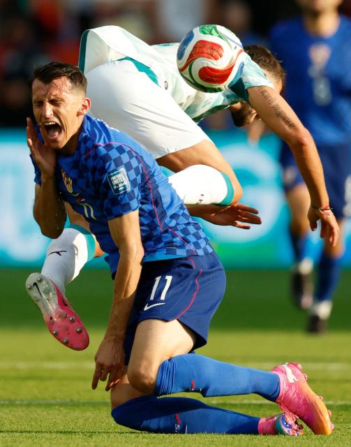 Croatia's forward #11 Ante Budimir is fouled by Portugal's defender #03 Ruben Dias during the 2026 World Cup round of 32 football match between Portugal and Croatia at the Toronto Stadium in Toronto on July 2, 2026.  (Photo by Kamil KRZACZYNSKI / AFP)