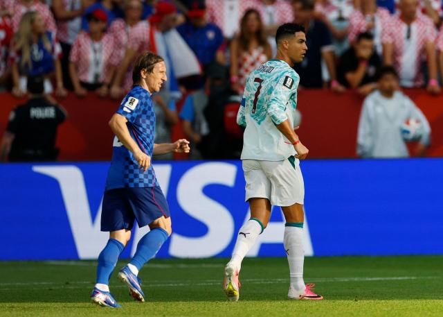 Croatia's midfielder #10 Luka Modric and Portugal's forward #07 Cristiano Ronaldo look for the ball during the 2026 World Cup round of 32 football match between Portugal and Croatia at the Toronto Stadium in Toronto on July 2, 2026.  (Photo by Kamil Krzaczynski / AFP)