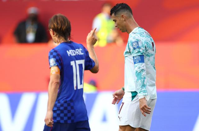 Portugal's forward #07 Cristiano Ronaldo and Croatia's midfielder #10 Luka Modric walk on the pitch during the 2026 World Cup round of 32 football match between Portugal and Croatia at the Toronto Stadium in Toronto on July 2, 2026.  (Photo by Cole Burston / AFP)