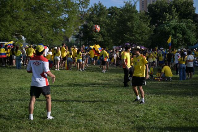 Colombian fans take part in a "banderazo" flag-waving gathering at Mill Creek Park in Kansas City on July 2, 2026, on the eve of the 2026 World Cup round of 32 football match between Colombia and Ghana. (Photo by JUAN MABROMATA / AFP)