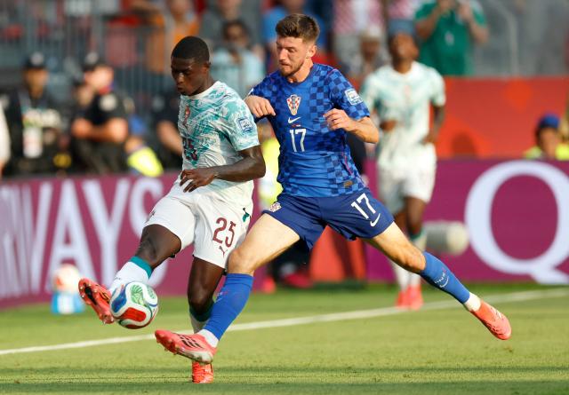 Portugal's defender #25 Nuno Mendes and Croatia's midfielder #17 Petar Sucic fight for the ball during the 2026 World Cup round of 32 football match between Portugal and Croatia at the Toronto Stadium in Toronto on July 2, 2026.  (Photo by Kamil Krzaczynski / AFP)