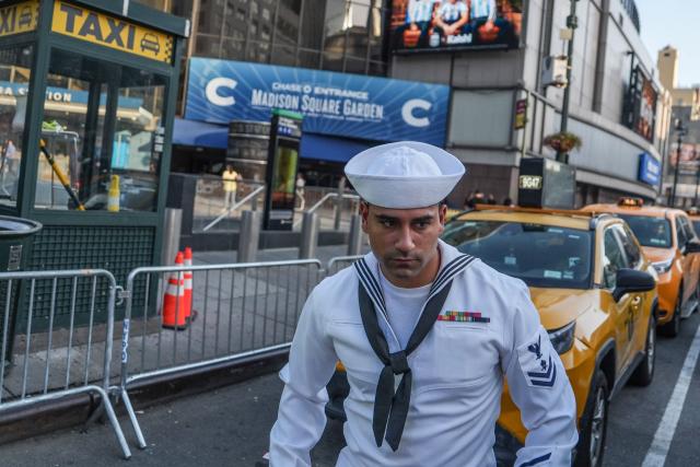 A US Navy sailor walks by Madison Square Garden in Manhattan, New York on July 2, 2026. Increasing signs point to a mega-bash for the A-list celebrity couple Taylor Swift and Travis Kelce at Madison Square Garden kicking off on July 2, 2026 with a rehearsal dinner. Rumors have run rampant for weeks that the 36-year-old pop superstar and the three-time NFL Super Bowl winner, also 36, could wed at the storied sports arena, home to the New York Knicks, the newly crowned NBA champions. (Photo by Ryan MURPHY / AFP)