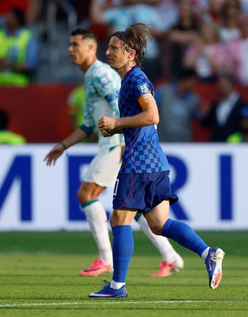 Croatia's midfielder #10 Luka Modric and Portugal's forward #07 Cristiano Ronaldo look for the ball during the 2026 World Cup round of 32 football match between Portugal and Croatia at the Toronto Stadium in Toronto on July 2, 2026.  (Photo by Kamil Krzaczynski / AFP)