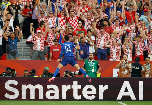 Croatia's forward #14 Ivan Perisic celebrates after scoring his team's first goal during the 2026 World Cup round of 32 football match between Portugal and Croatia at the Toronto Stadium in Toronto on July 2, 2026.  (Photo by Kamil Krzaczynski / AFP)