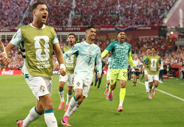Portugal's forward #07 Cristiano Ronaldo celebrates with teammates after his team scored their second goal during the 2026 World Cup round of 32 football match between Portugal and Croatia at the Toronto Stadium in Toronto on July 2, 2026.  (Photo by Cole Burston / AFP)