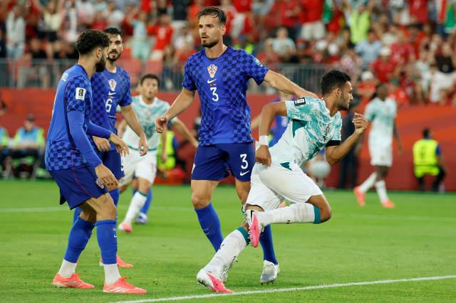 Portugal's forward #09 Goncalo Ramos (R) celebrates after scoring his team's second goal during the 2026 World Cup round of 32 football match between Portugal and Croatia at the Toronto Stadium in Toronto on July 2, 2026.  (Photo by Kamil Krzaczynski / AFP)