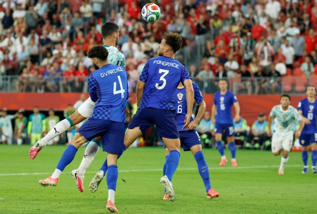 Portugal's forward #09 Goncalo Ramos (top) heads the ball to score his team's second goal during the 2026 World Cup round of 32 football match between Portugal and Croatia at the Toronto Stadium in Toronto on July 2, 2026.  (Photo by Kamil Krzaczynski / AFP)