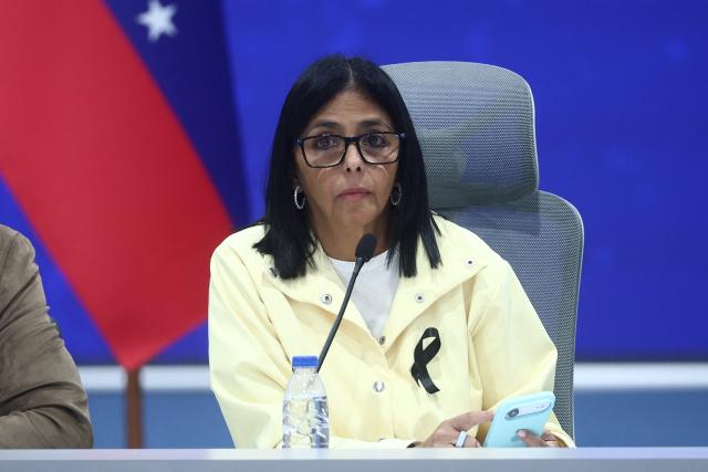 Venezuela's interim President Delcy Rodriguez looks on during a press conference at the Generalisimo Francisco de Miranda Air Base in Caracas on July 2, 2026. At least 2,595 people have died as a result of the twin earthquakes that struck Venezuela on June 24, interim President Delcy Rodriguez announced on July 2, adding that all of the victims will be properly identified. (Photo by Lucas AGUAYO / AFP)
