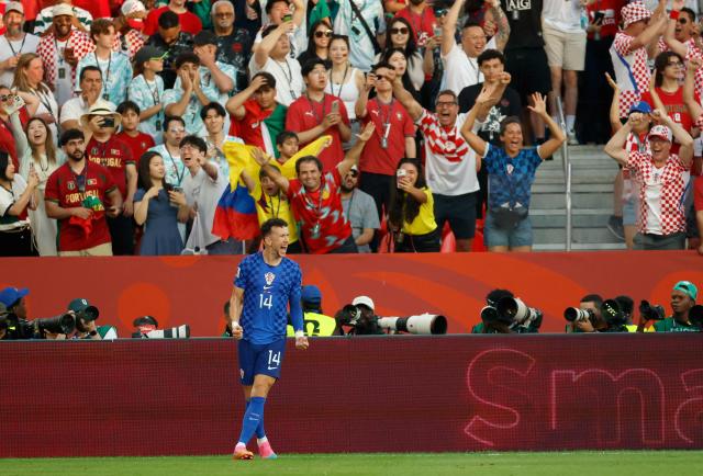 Croatia's forward #14 Ivan Perisic celebrates after scoring his team's first goal during the 2026 World Cup round of 32 football match between Portugal and Croatia at the Toronto Stadium in Toronto on July 2, 2026.  (Photo by Kamil Krzaczynski / AFP)