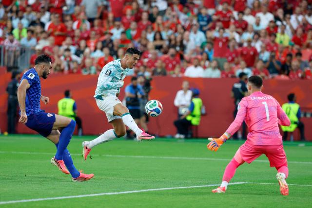 Portugal's forward #07 Cristiano Ronaldo (C) scores a goal later disallowed by offside during the 2026 World Cup round of 32 football match between Portugal and Croatia at the Toronto Stadium in Toronto on July 2, 2026.  (Photo by Kamil Krzaczynski / AFP)