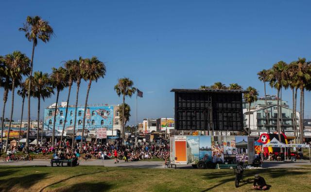 Fans watch the 2026 FIFA World Cup Round of 32 football match between Portugal and Croatia on a giant screen set on Venice Beach boardwalk in Venice, California, on July 2, 2026. (Photo by Apu GOMES / AFP)