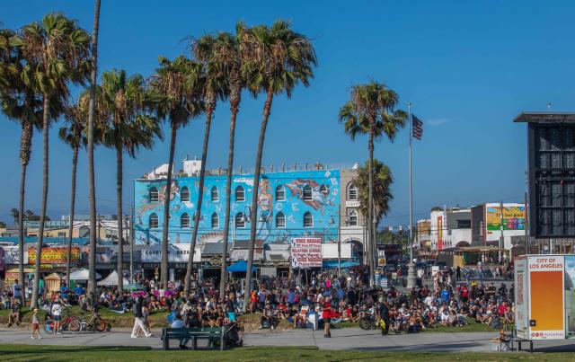 Fans watch the 2026 FIFA World Cup Round of 32 football match between Portugal and Croatia on a giant screen set on Venice Beach boardwalk in Venice, California, on July 2, 2026. (Photo by Apu GOMES / AFP)