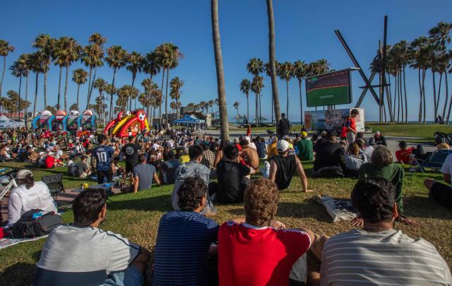 Fans watch the 2026 FIFA World Cup Round of 32 football match between Portugal and Croatia on a giant screen set on Venice Beach boardwalk in Venice, California, on July 2, 2026. (Photo by Apu GOMES / AFP)