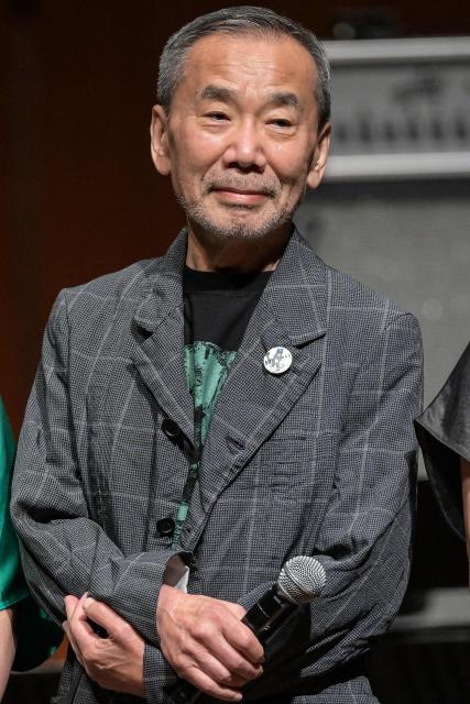 (FILES) Japanese author Haruki Murakami poses during a photo call following a performance entitled the “Haruki Murakami produce Murakami JAM vol.3 – A hot and gentle fusion night”, at the Sumida Triphony Hall in Tokyo on June 29, 2024. Haruki Murakami writes novels that are "completely different" from what AI can create, the Japanese novelist said in an interview published on July 3, 2026. (Photo by Richard A. Brooks / AFP)