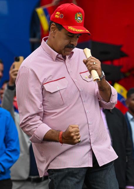 (FILES) Venezuela's President Nicolas Maduro dances during a rally in Caracas on December 1, 2025. July 3, 2026 marks six months since the capture of Nicolas Maduro during a US military operation in Venezuela. (Photo by Juan BARRETO / AFP)