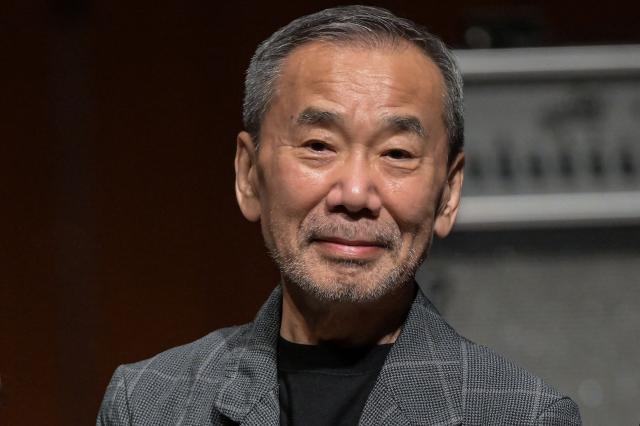 (FILES) Japanese author Haruki Murakami poses during a photo call following a performance entitled the “Haruki Murakami produce Murakami JAM vol.3 – A hot and gentle fusion night”, at the Sumida Triphony Hall in Tokyo on June 29, 2024. Haruki Murakami writes novels that are "completely different" from what AI can create, the Japanese novelist said in an interview published on July 3, 2026. (Photo by Richard A. Brooks / AFP)