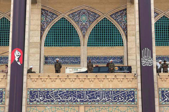 Members of Iranian security personnel stand guard at the Grand Mosalla in Tehran on July 3, 2026, ahead of Iran's slain supreme leader Ali Khamenei's funeral. Preparations for the funeral of Khamenei were in full swing on July 3, with authorities expecting millions and a coterie of foreign dignitaries to attend the official ceremony. (Photo by Atta KENARE / AFP) / 