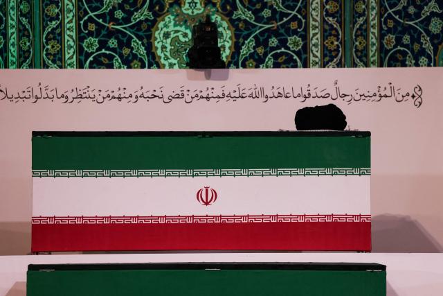 The coffin of Iran's slain supreme leader Ali Khamenei is pictured at the Grand Mosalla in Tehran on July 3, 2026. The body of Iran's supreme leader Ali Khamenei, who was killed in US-Israeli strikes, arrived at Tehran's Grand Mosalla religious complex ahead of his funeral, state media reported on July 3. (Photo by Atta KENARE / AFP) / 
