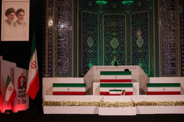 The coffins of Iran's slain supreme leader Ali Khamenei and his family members are pictured at the Grand Mosalla in Tehran on July 3, 2026. The body of Iran's supreme leader Ali Khamenei, who was killed in US-Israeli strikes, arrived at Tehran's Grand Mosalla religious complex ahead of his funeral, state media reported on July 3. (Photo by Atta KENARE / AFP) / 