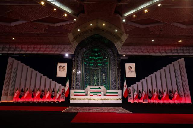 The coffins of Iran's slain supreme leader Ali Khamenei and his family members are pictured at the Grand Mosalla in Tehran on July 3, 2026. The body of Iran's supreme leader Ali Khamenei, who was killed in US-Israeli strikes, arrived at Tehran's Grand Mosalla religious complex ahead of his funeral, state media reported on July 3. The body of Iran's supreme leader who was killed in US-Israeli strikes that triggered the Middle East war arrived at Tehran's Grand Mosalla on Friday ahead of his funeral, state media reported. Millions of people and a coterie of foreign dignitaries were expected to attend July 4 official ceremony for Ali Khamenei, with Tehran's chief negotiator calling for a massive turnout to avenge his death. (Photo by Atta KENARE / AFP) / 