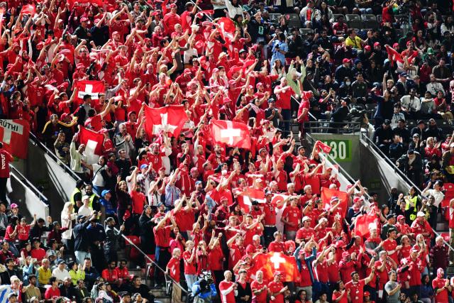 Switzerland fans cheer after their team's victory over Algeria at the conclusion of the 2026 World Cup round of 32 football match the BC Place Vancouver Stadium in Vancouver on July 2, 2026.  (Photo by Don MacKinnon / AFP)