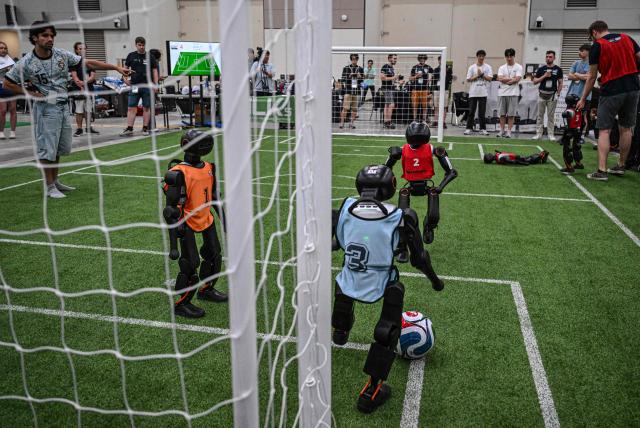 Robots take part in a football match at RoboCup 2026, a robotics and Artificial Intelligence (AI) competition in Incheon on July 3, 2026. (Photo by Jade GAO / AFP)