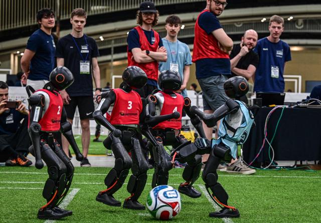 Robots take part in a football match at RoboCup 2026, a robotics and Artificial Intelligence (AI) competition in Incheon on July 3, 2026. (Photo by Jade GAO / AFP)