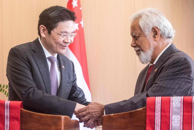 Singaporean Prime Minister Lawrence Wong (L) and East Timor's Prime Minister Xanana Gusmao shake hands at the Government Palace in Dili on July 3, 2026. (Photo by Valentino Dariell DE SOUSA / AFP)