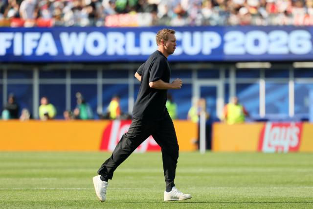 (FILES) Germany's head coach Julian Nagelsmann walks on the pitch at halftime of the 2026 World Cup round of 32 football match between Germany and Paraguay at the Boston Stadium in Foxborough on June 29, 2026. Germany coach Julian Nagelsmann has resigned following his team's shock last-32 exit from the World Cup at the hands of Paraguay, several media reported on July 3, 2026. (Photo by Odd ANDERSEN / AFP)