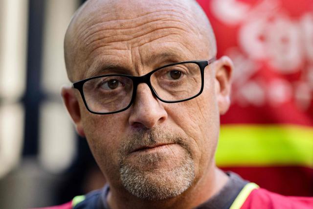 Mael Le Goff, CGT delegate of Fonderie de Bretagne (FDB) foundry, a subsidiary of French car maker Renault group, looks on as he gathers in front of the commercial Courthouse in Lorient, Western France on July 3, 2026, as the FDB, taken over last year by Europlasma, was placed into bankrupcy protection. The foundry, based in Caudan (Morbihan) and employing 245 people, now has until July 17, 2026 to find three million euros. (Photo by Fred TANNEAU / AFP)