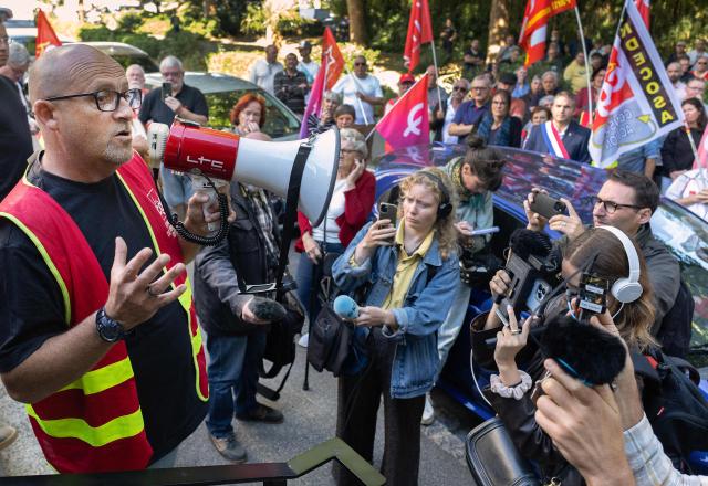 Mael Le Goff, CGT delegate of Fonderie de Bretagne (FDB) foundry, a subsidiary of French car maker Renault group, addresses employees as they gather in front of the commercial Courthouse in Lorient, Western France on July 3, 2026, as the FDB, taken over last year by Europlasma, was placed into bankrupcy protection. The foundry, based in Caudan (Morbihan) and employing 245 people, now has until July 17, 2026 to find three million euros. (Photo by Fred TANNEAU / AFP)