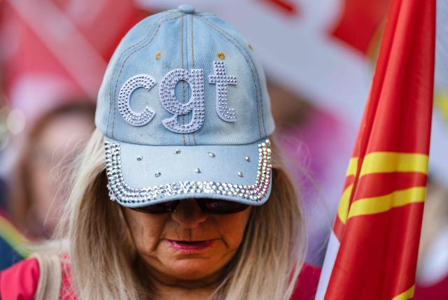 An employee of the Fonderie de Bretagne (FDB) foundry, a subsidiary of French car maker Renault group, takes part in a protest in front of the commercial Courthouse in Lorient, Western France on July 3, 2026, as the FDB, taken over last year by Europlasma, was placed into bankrupcy protection. The foundry, based in Caudan (Morbihan) and employing 245 people, now has until July 17, 2026 to find three million euros. (Photo by Fred TANNEAU / AFP)