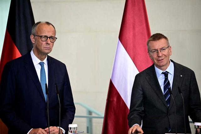 German Chancellor Friedrich Merz (L) and Latvian President Edgars Rinkevics address a joint press conference after a meeting at the Chancellery in Berlin on July 3, 2026. (Photo by Tobias SCHWARZ / AFP)