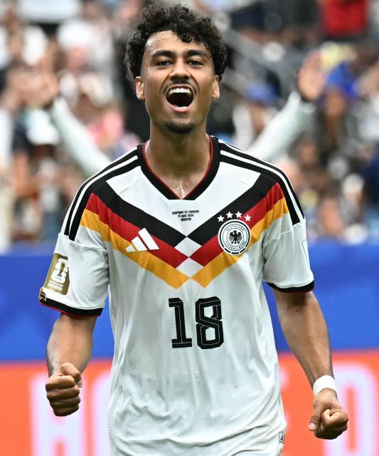 (FILES) Germany's defender #18 Nathaniel Brown celebrates after scoring a goal during the 2026 World Cup Group E football match between Germany and Curacao at the Houston Stadium in Houston on June 14, 2026. FC Bayern have signed Germany international Nathaniel Brown, 23, from Eintracht Frankfurt on a contract until June 30, 2031 the club announced on July 3, 2026. (Photo by Paul ELLIS / AFP)