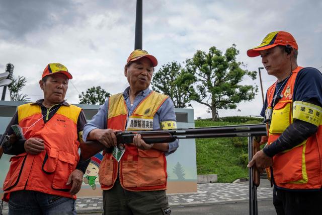 Local hunters holding training rifles take part in an emergency response drill for bear and other wildlife intrusions, in Isehara, Kanagawa Prefecture on July 3, 2026. (Photo by Yuichi YAMAZAKI / AFP)