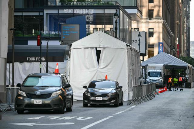 Multiple tented entrances are seen outside Madison Square Garden, the reported venue for the wedding celebrations of pop singer Taylor Swift and pro-athlete Travis Kelce, in New York City on July 3, 2026. Swift and Kelce's official wedding plans are tightly under wraps, but New York is bracing to host the celebrity marriage of the year this week at Madison Square Garden. The wedding will reportedly take place Friday with a star-studded guest list of around 1,000, including models Gigi Hadid and Cara Delevingne, singer Selena Gomez, and actress Zoe Kravitz -- all known to be close Swift pals -- and Kelce's Kansas City Chiefs teammates. (Photo by ANGELA WEISS / AFP)