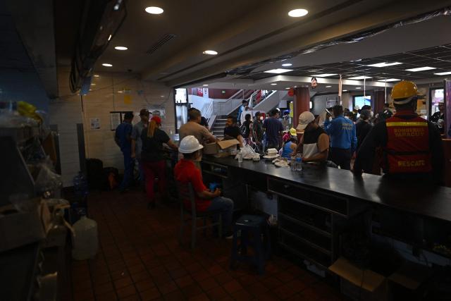 View of a McDonald's restaurant operating as a medical care center following twin earthquakes in Caraballeda, La Guaira, Venezuela, on July 3, 2026. The death toll from Venezuela's twin earthquakes has risen to 2,595, Interim President Delcy Rodriguez said on July 2. (Photo by Juan BARRETO / AFP)