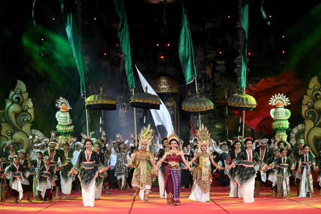 Balinese dancers perform during the Bali Art Festival in Denpasar, Indonesia's resort island of Bali on July 3, 2026. (Photo by SONNY TUMBELAKA / AFP)