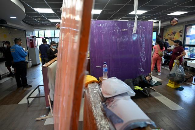 View of a McDonald's restaurant operating as a medical care center following twin earthquakes in Caraballeda, La Guaira, Venezuela, on July 3, 2026. The death toll from Venezuela's twin earthquakes has risen to 2,595, Interim President Delcy Rodriguez said on July 2. (Photo by Juan BARRETO / AFP)