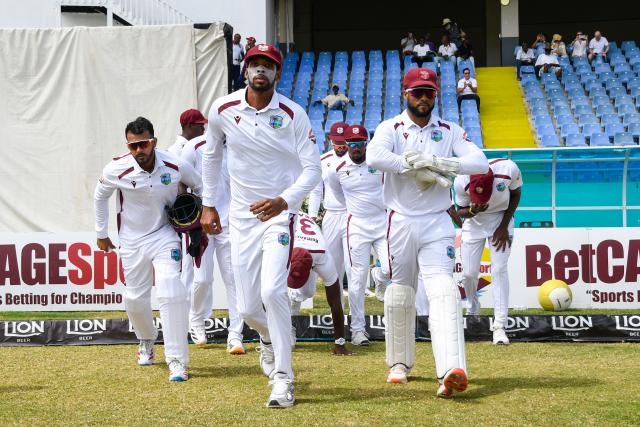 Roston Chase (2L) and Shai Hope (R) of West Indies leading the team on to the field during day one of the second Test cricket match between West Indies and Sri Lanka at Sir Vivian Richards Stadium in North Sound, Antigua and Barbuda, on July 3, 2026. (Photo by Randy Brooks / AFP)