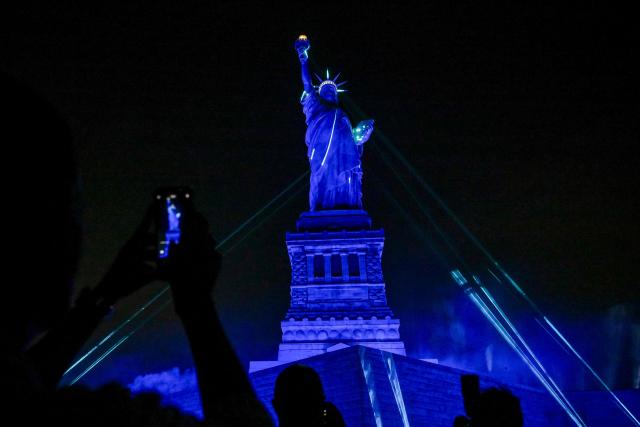 The Statue of Liberty is illuminated during the special event "Liberty Lights" to celebrate the 250th anniversary of US independence on Liberty Island in New York City, on July 1, 2026. Techno music and lasers brought the Statue of Liberty to life as a light show at the iconic monument will be broadcast on July 3, 2026, to mark the United States' 250th anniversary. The 15-minute spectacle will be shown on the ABC network as an initiative of France, which gifted the monument to the United States in 1886 in celebration of American independence. (Photo by ANGELA WEISS / AFP)
