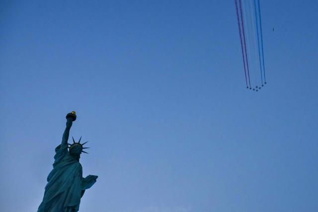 The Patrouille de France performs a flyover above the Statue of Liberty to celebrate the 250th anniversary of US independence on Liberty Island in New York City, on July 1, 2026. Techno music and lasers brought the Statue of Liberty to life as a light show at the iconic monument will be broadcast on July 3, 2026, to mark the United States' 250th anniversary. The 15-minute spectacle will be shown on the ABC network as an initiative of France, which gifted the monument to the United States in 1886 in celebration of American independence. (Photo by ANGELA WEISS / AFP)