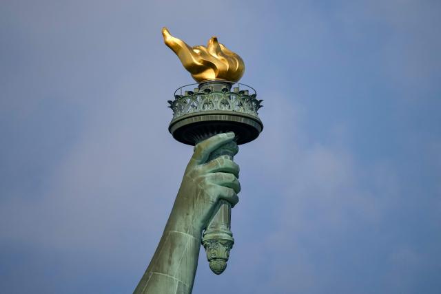 The Statue of Liberty's torch is seen ahead of celebrations for the 250th anniversary of US independence on Liberty Island in New York City, on July 1, 2026. Techno music and lasers brought the Statue of Liberty to life as a light show at the iconic monument will be broadcast on July 3, 2026, to mark the United States' 250th anniversary. The 15-minute spectacle will be shown on the ABC network as an initiative of France, which gifted the monument to the United States in 1886 in celebration of American independence. (Photo by ANGELA WEISS / AFP)