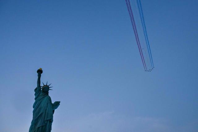 The Patrouille de France performs a flyover above the Statue of Liberty to celebrate the 250th anniversary of US independence on Liberty Island in New York City, on July 1, 2026. Techno music and lasers brought the Statue of Liberty to life as a light show at the iconic monument will be broadcast on July 3, 2026, to mark the United States' 250th anniversary. The 15-minute spectacle will be shown on the ABC network as an initiative of France, which gifted the monument to the United States in 1886 in celebration of American independence. (Photo by ANGELA WEISS / AFP)